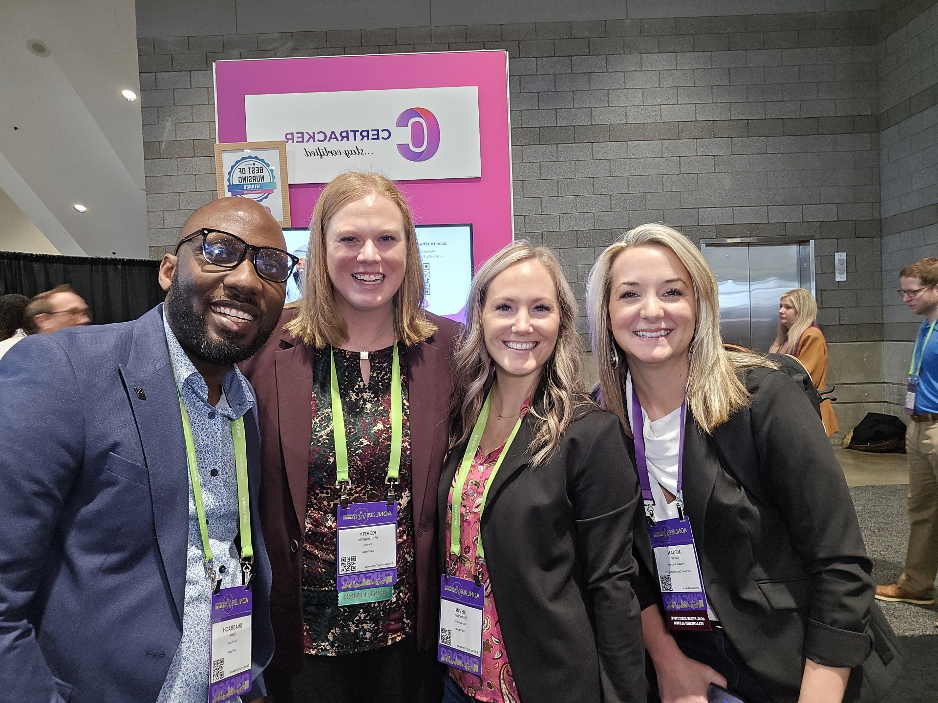 CerTracker co-founders Devin Patterson (RN) and Shadrach Igwe demonstrating nurse credential management software at the CerTracker booth, AONL Chicago